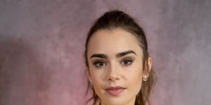 lily collins side sweeping micro fringe gives 50s audrey hepburn vibes