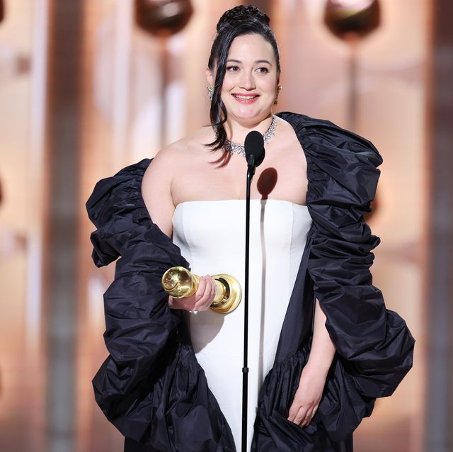 lily gladstone on stage at the golden globes