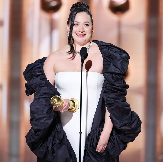lily gladstone on stage at the golden globes