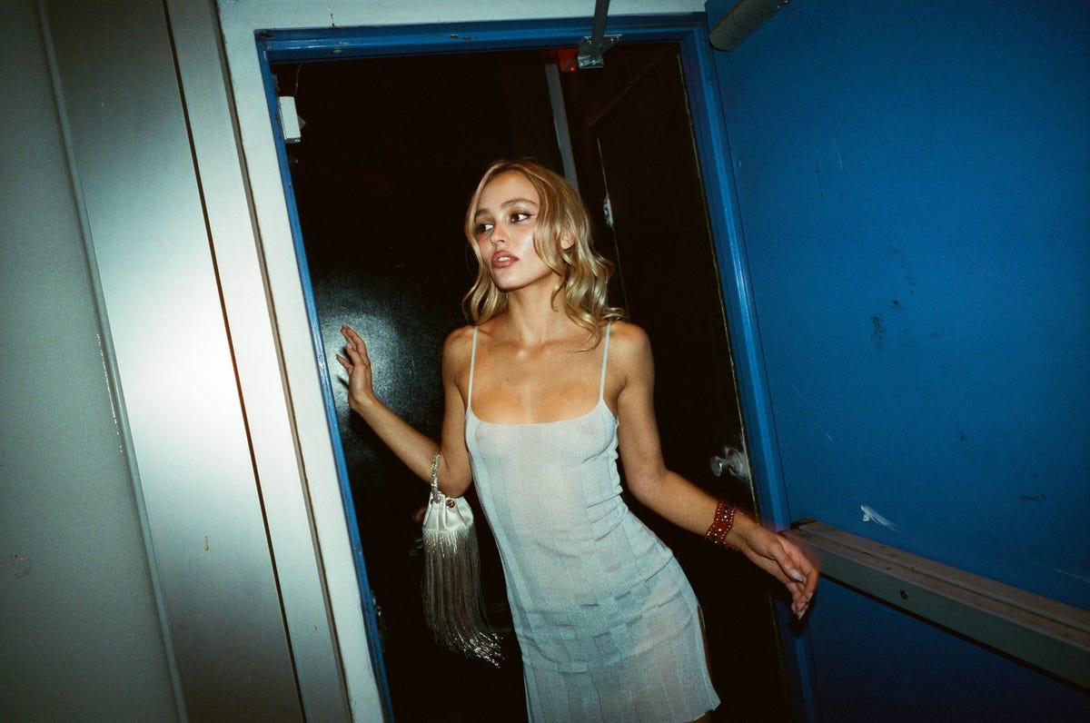 Lily Rose Depp Celebrates the Premiere of "The Idol" in a Sheer White Naked Dress