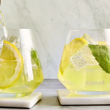 limoncello spritz filled with basil and lemon slices