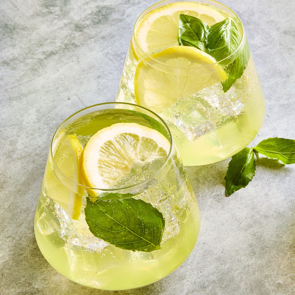 limoncello spritz filled with basil and lemon slices