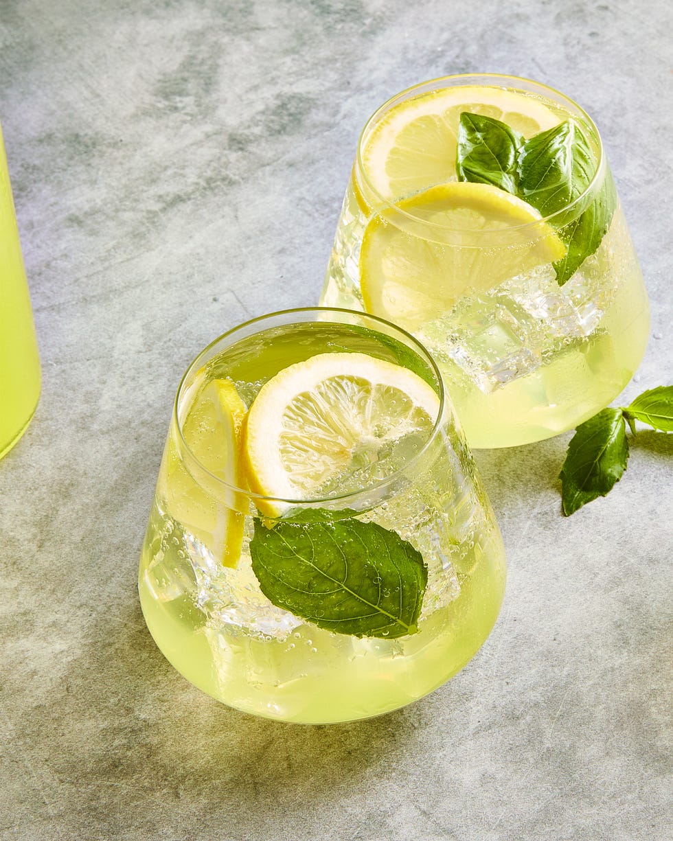 limoncello spritz filled with basil and lemon slices