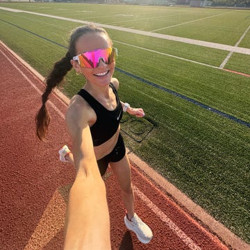 runner in athletic wear on a track field runner in athletic wear on a track field