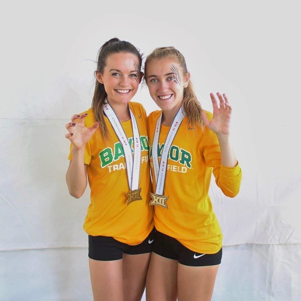 two track teammates posing