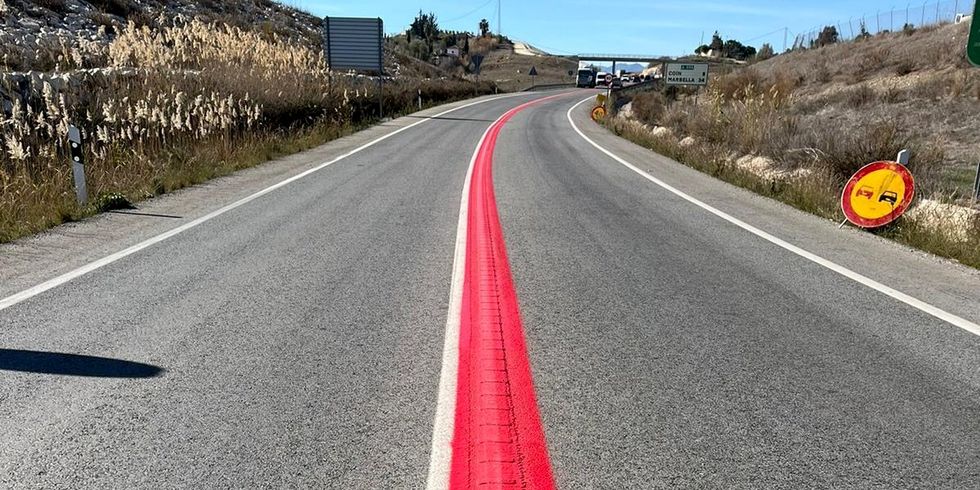 a road with a red line