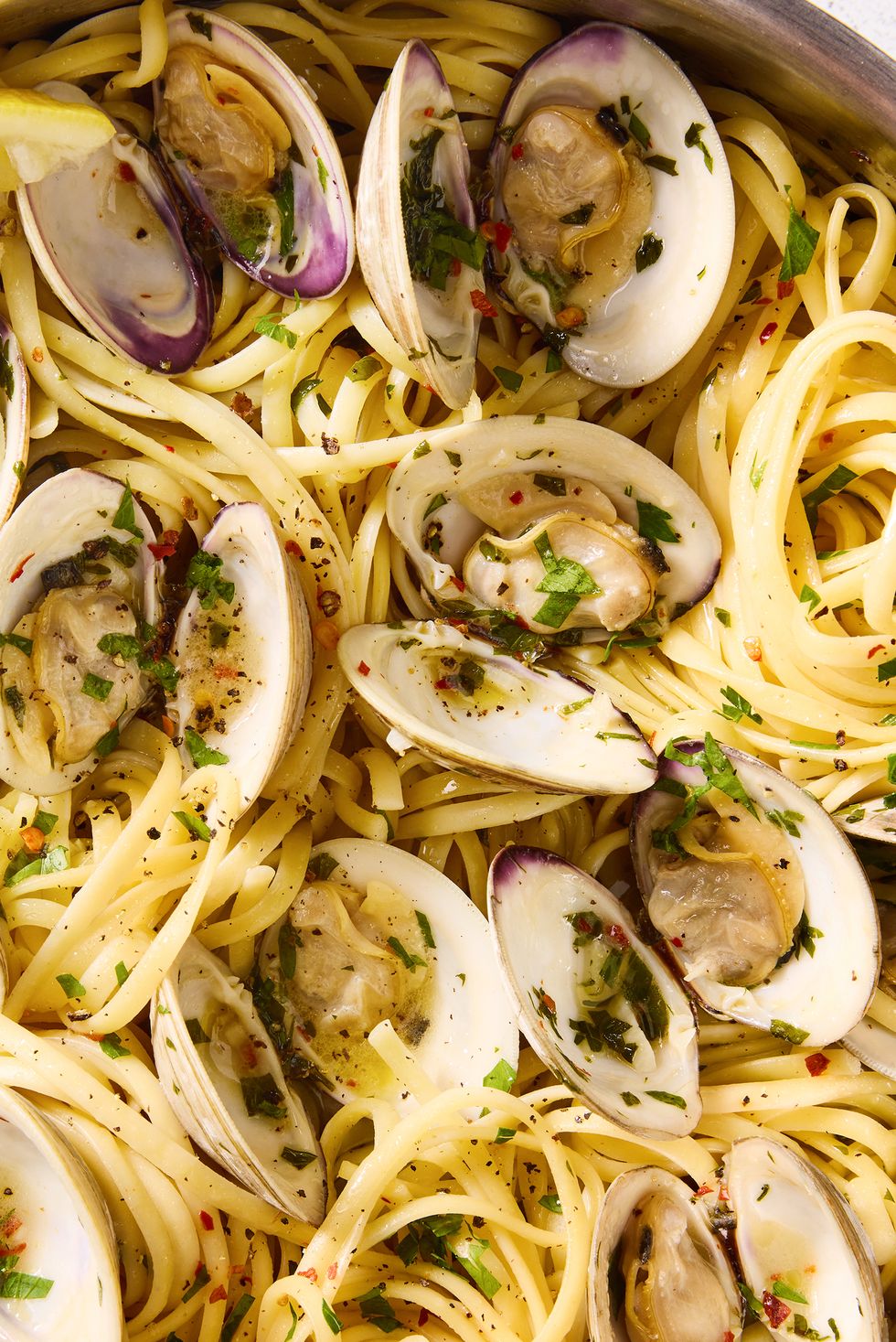 linguine with clams fresh herbs, lemon, and red pepper flakes