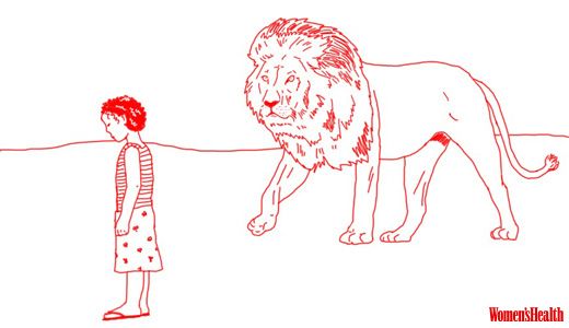 a lion looking at a girl