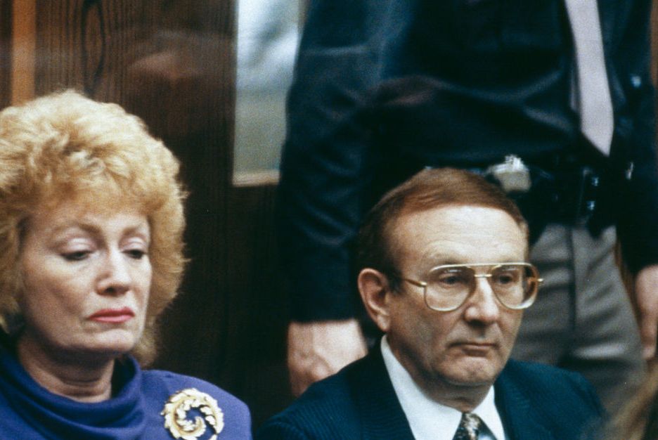 lionel dahmer and his second wife looking on inside a courtroom