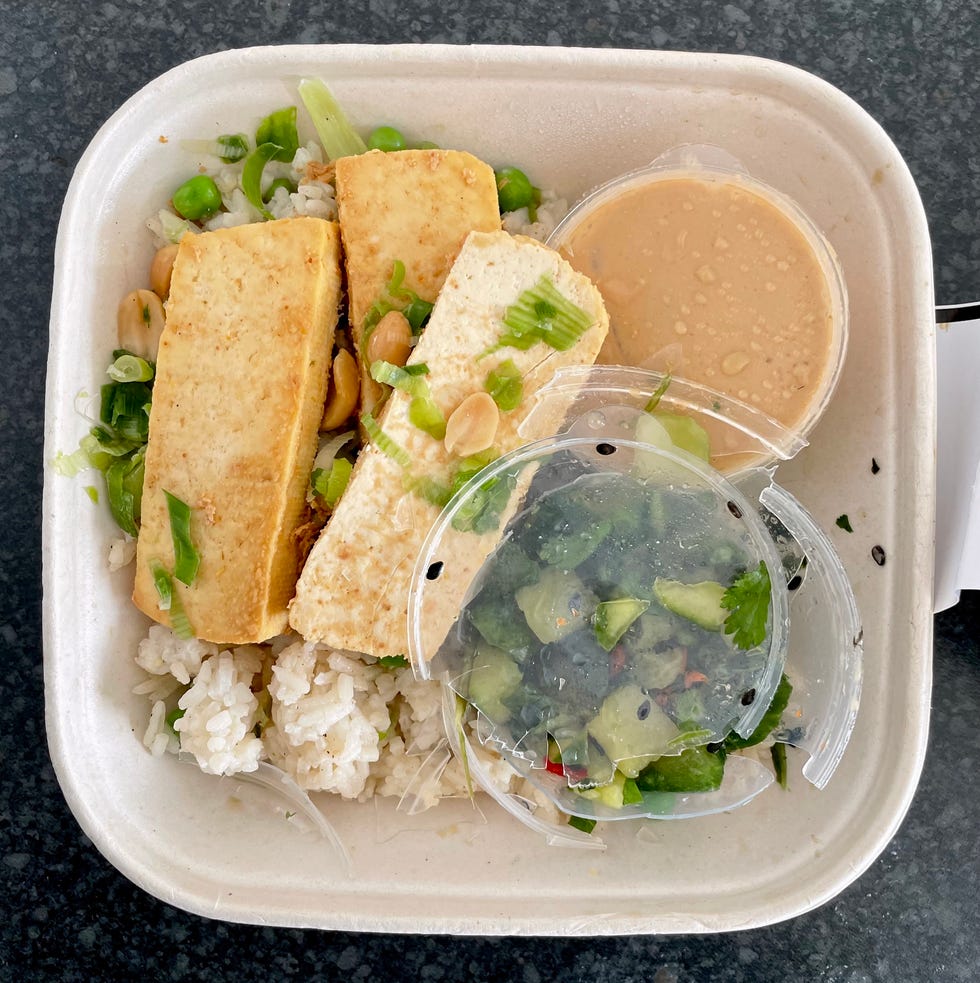 a lions prep meal with a smashed plastic tub in it with the plastic shards in the food