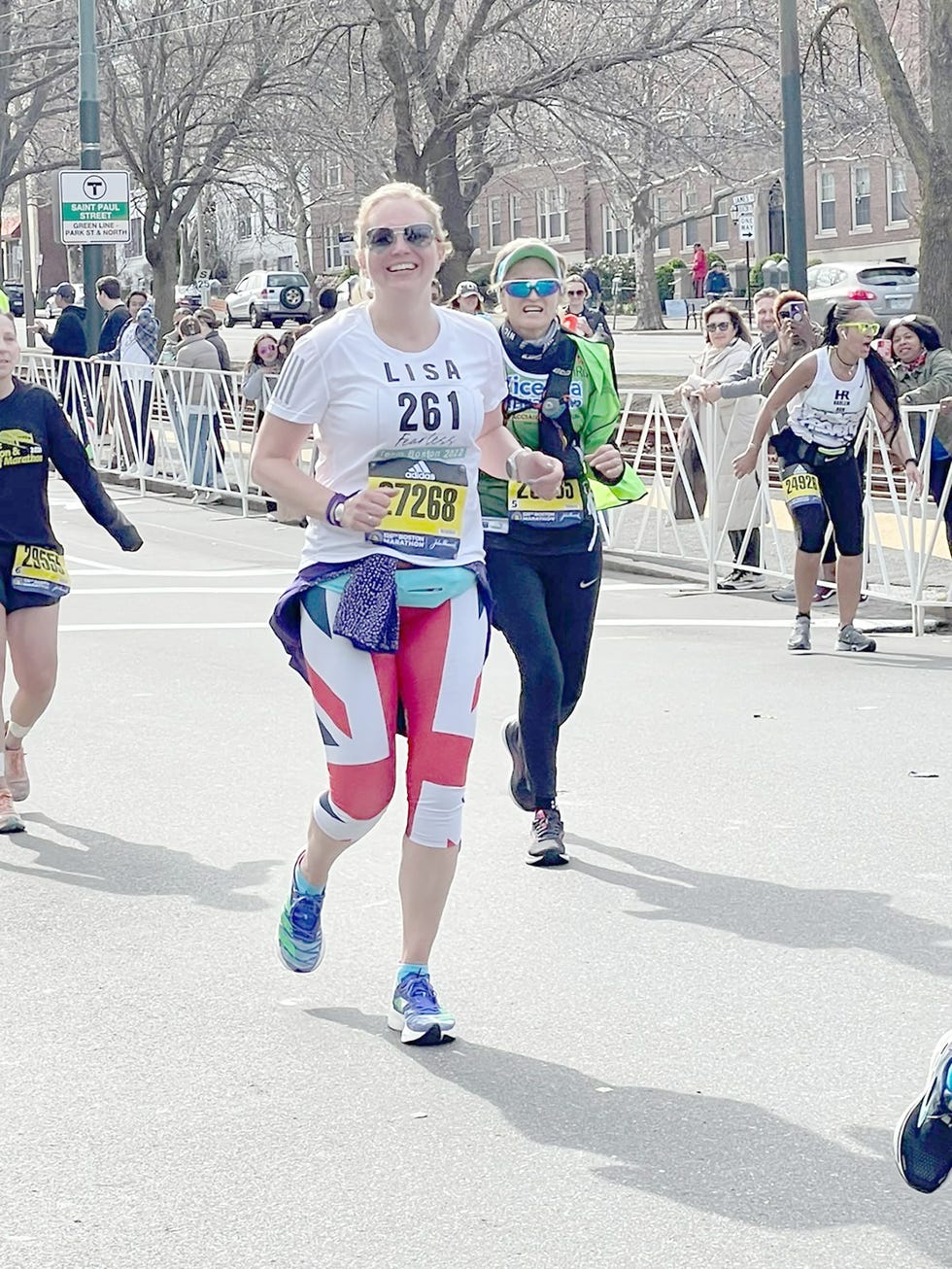 participants running in a race with visible bib numbers and athletic wear