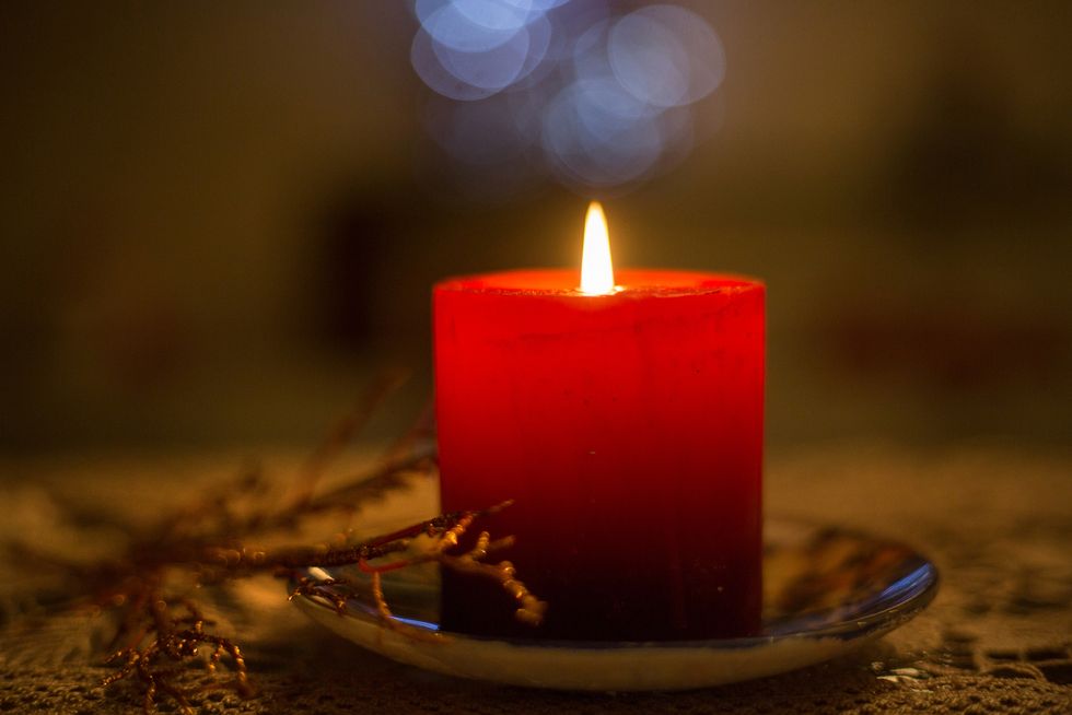 lit candle, christmas ornaments