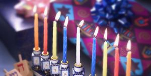 lit menorah and hanukkah presents