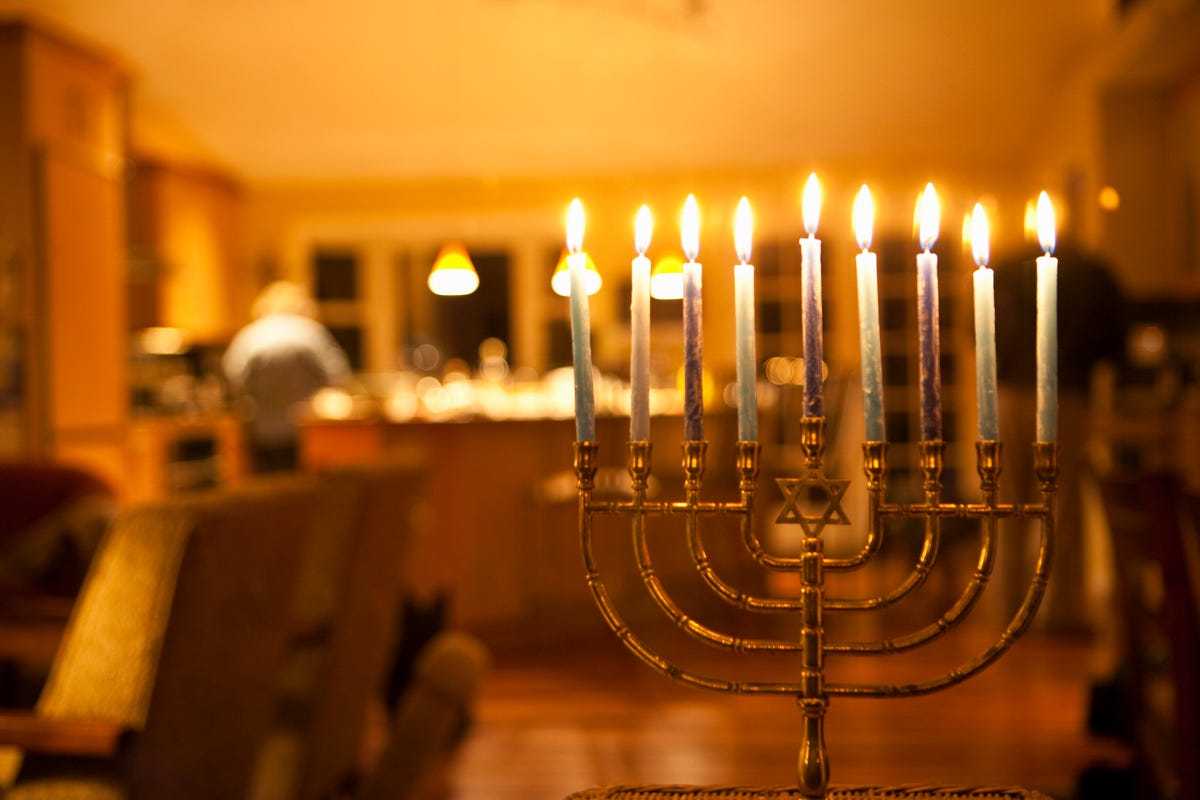 https://hips.hearstapps.com/hmg-prod/images/lit-menorah-in-home-royalty-free-image-1635538003.jpg?crop=0.668xw:1.00xh;0.236xw,0&resize=1200:*