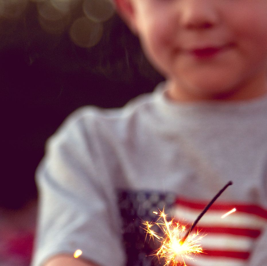 little boy holding sparkler