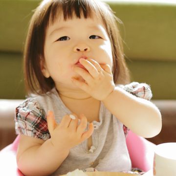 little girl eating a meal,close up