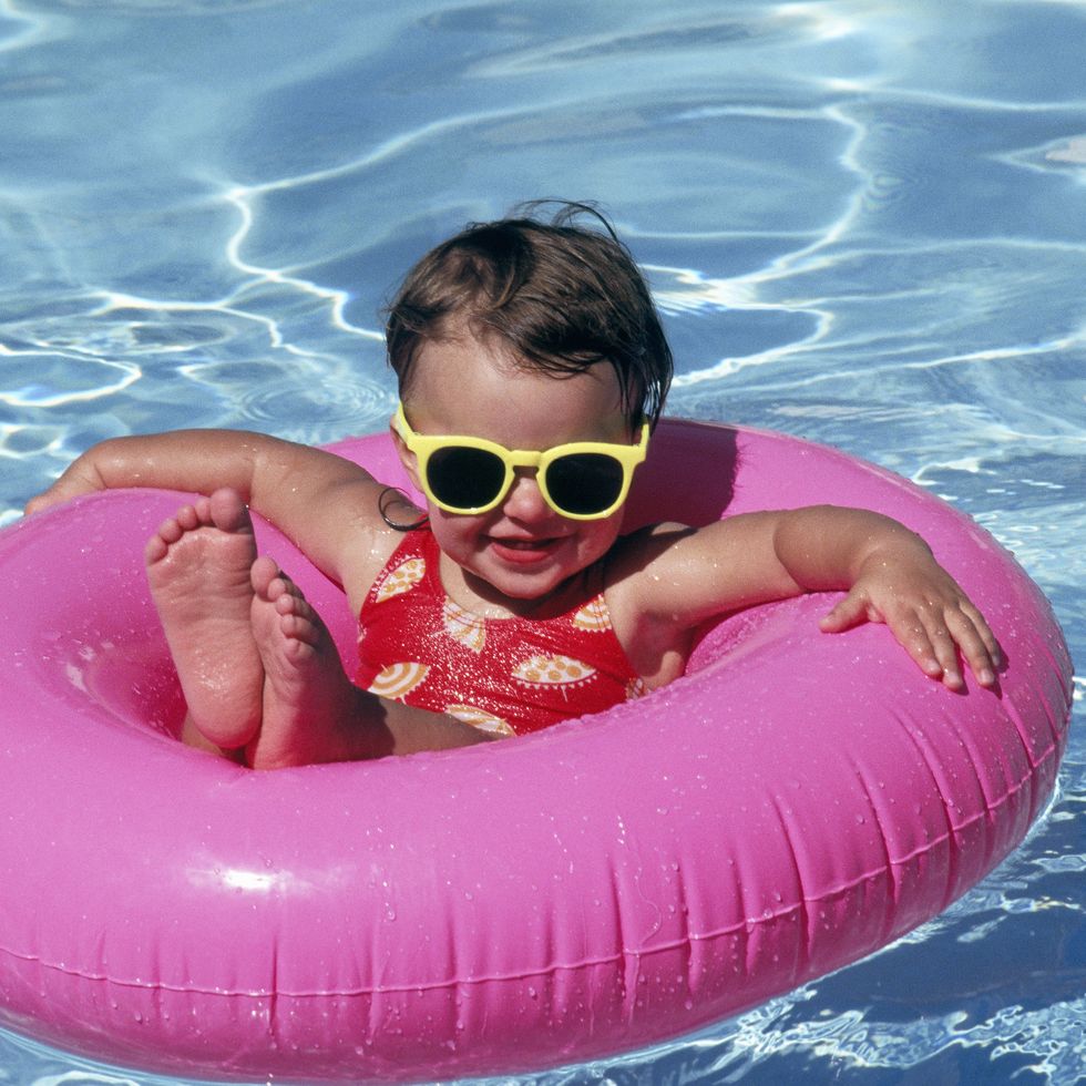 little girl in awimming pool