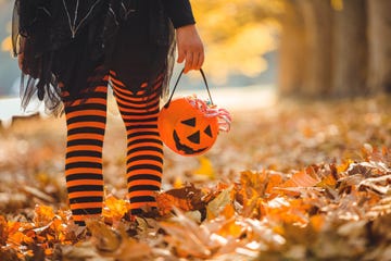 little girl in halloween costumes goes to trick or treating