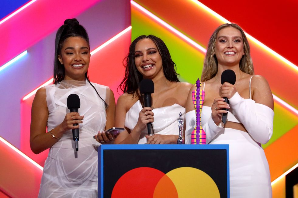 leigh anne pinnock, jade thirlwall and perrie edwards of little mix on stage after winning the british group award during the brit awards 2021