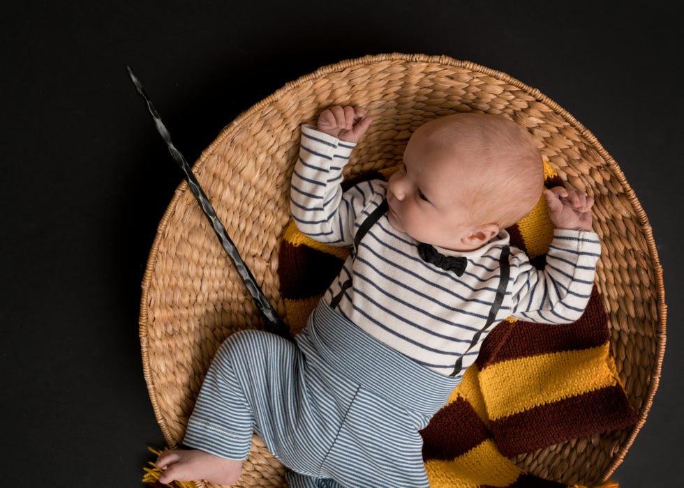 little newborn baby boy like in a magic book in halloween time