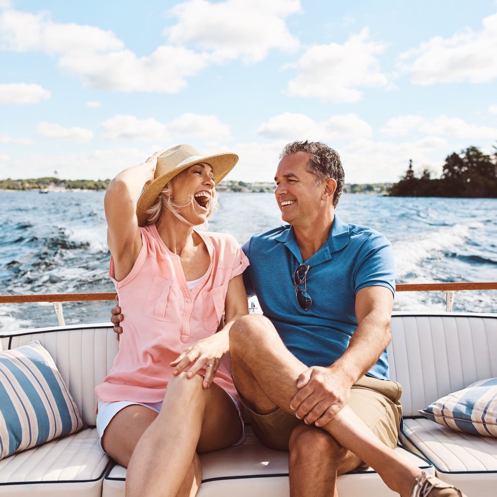 mature couple on a summer date on a boat