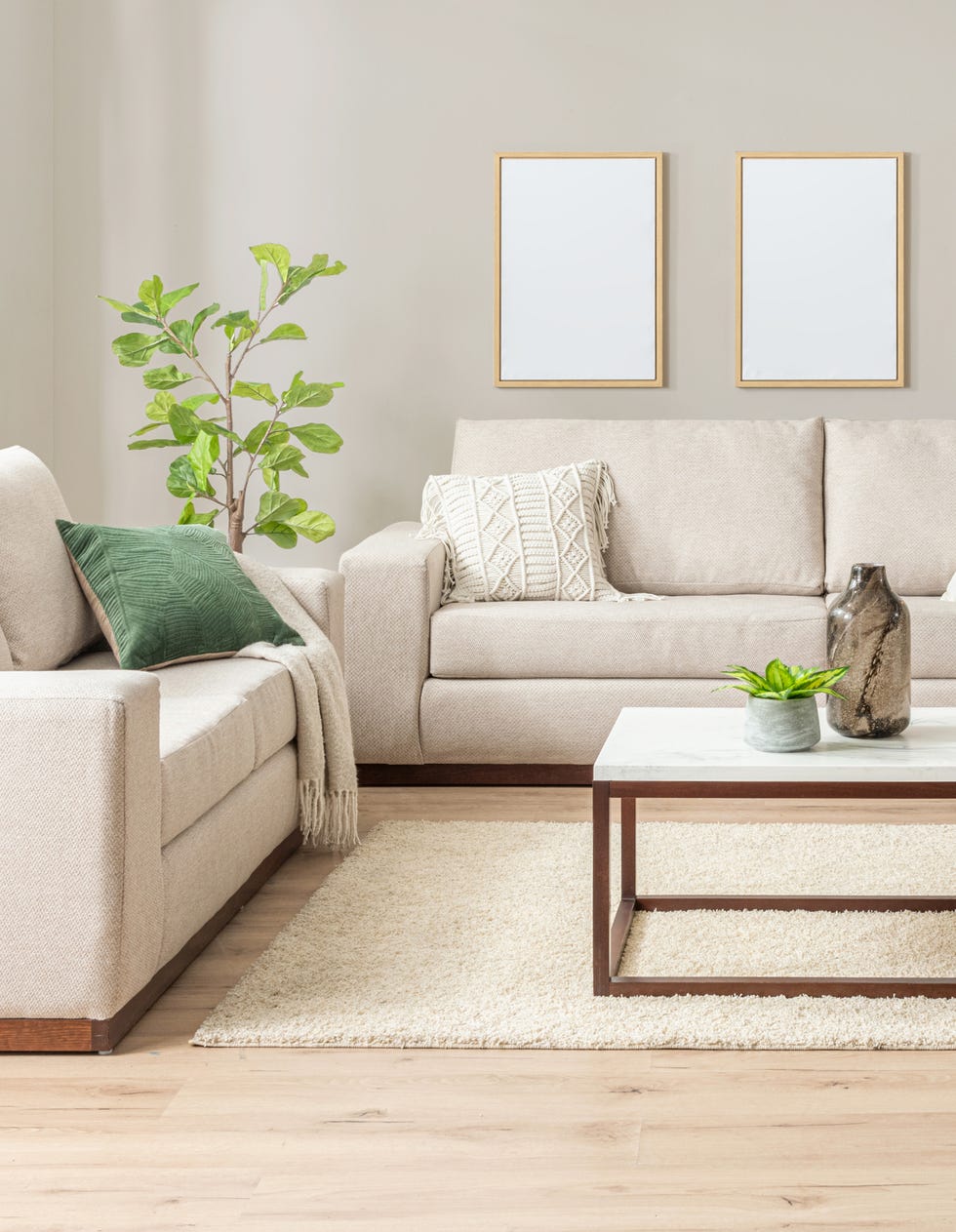 living room setup with sofas coffee table and decorative elements