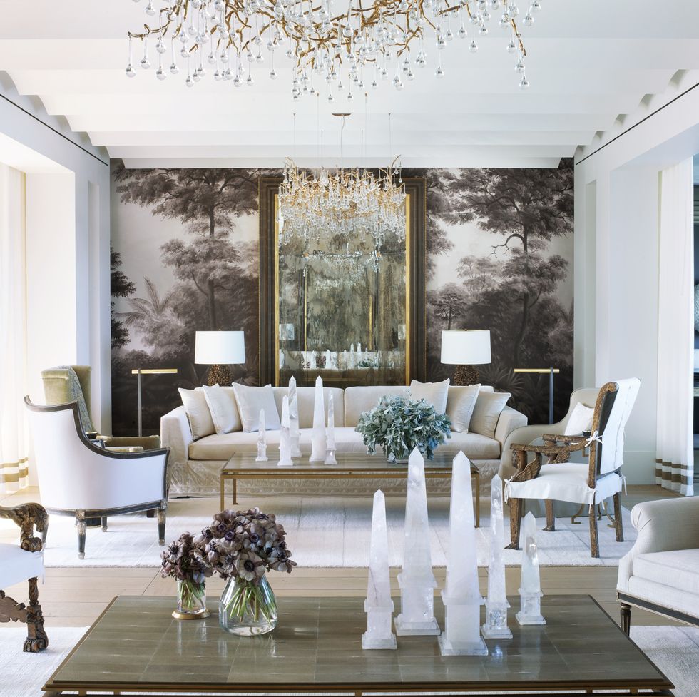 elizabeth and stanley star's home in naples, florida designed by bobby mcalpine and susan ferrier a tropical grisaille mural ananbô headlines the living room sofa, promemoria