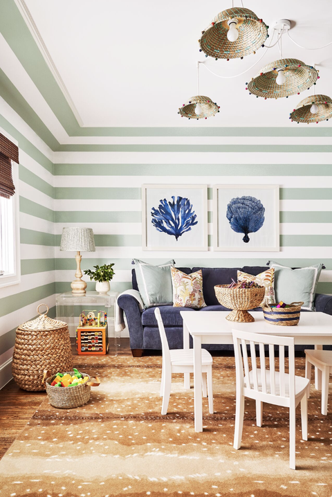 living room ideas green and white striped walls in a room with art and a sofa