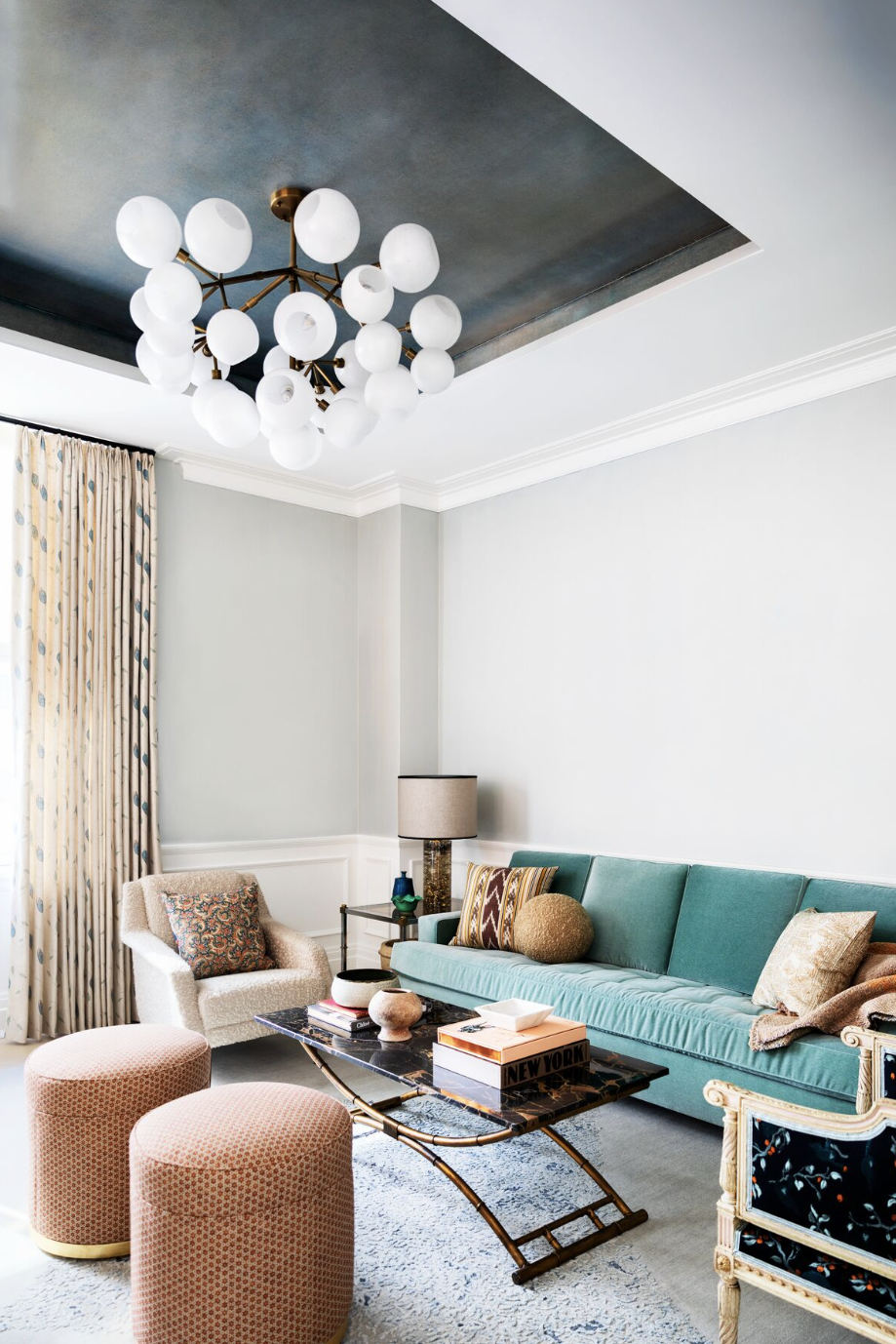 Living room ideas, tray ceiling in a room with globe lighting and turquoise sofa