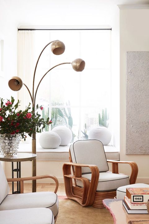 white living room with three tiered floor lamp