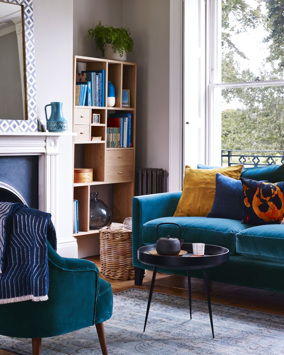Premium Photo  Stylish composition of living room interior with corner  grey sofa design furniture and minimalist personal accessories book shelf  modern home decor template