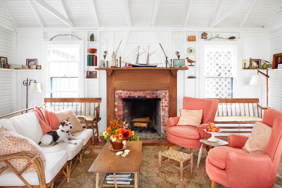 a kick back kind of cottage on marthas vineyard with white walls and coral accents