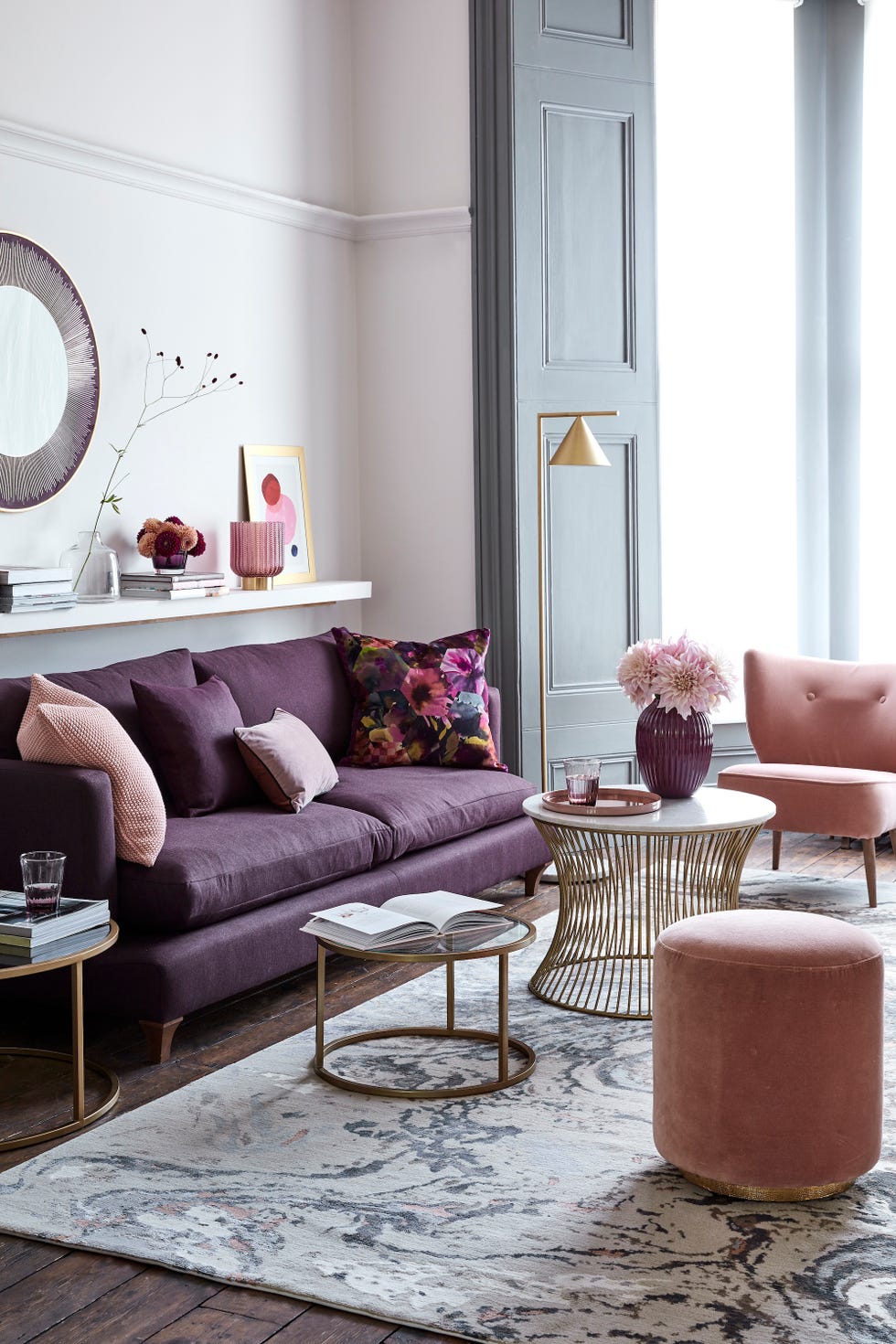 living room with touches of gold, marble and wood with accents of plum and mulberry