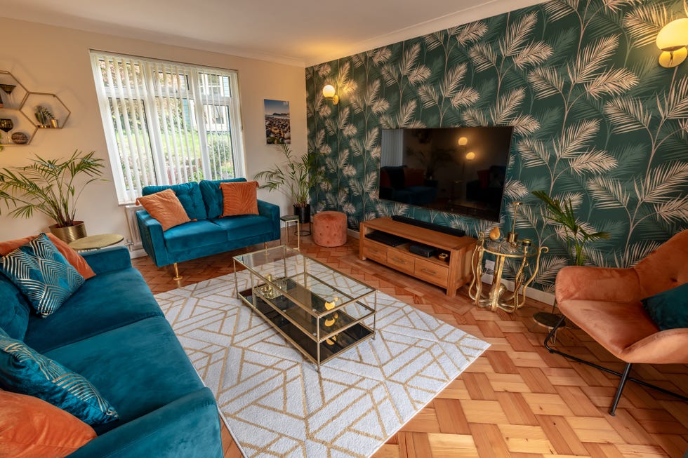 wall mounted tv in sitting room setting with parquet floor