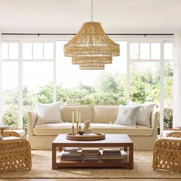 a living room with a chandelier and a couch