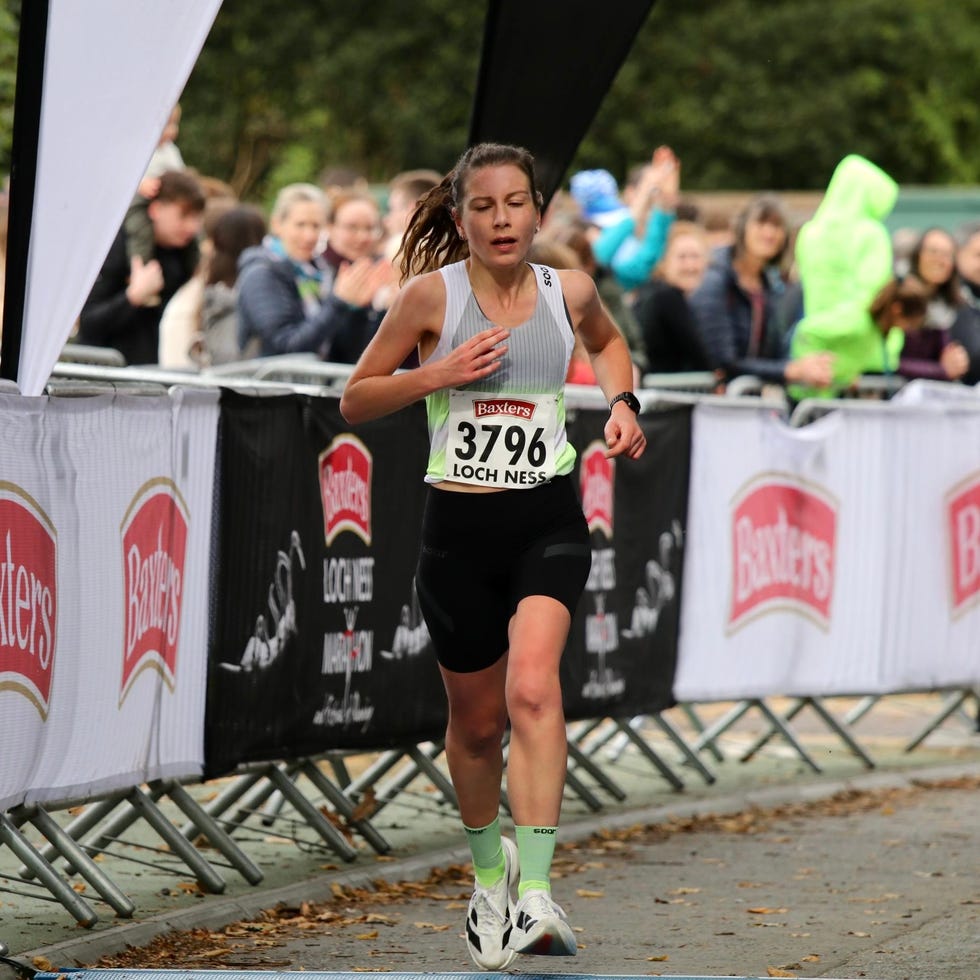 athlete competing in a running event with a visible race number