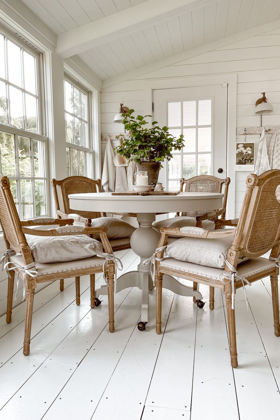 sunroom ideas with a white wooden floor