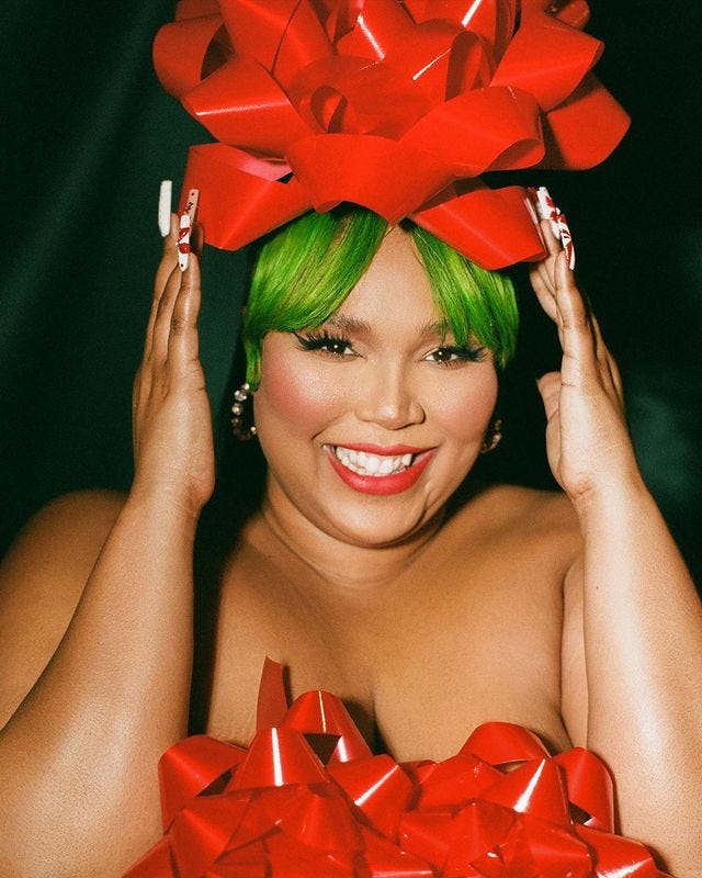 Lizzo goes full festive in an xxmas candy stripe outfit