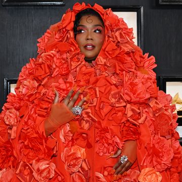 lizzo at grammys in orange flower outfit and orange nails