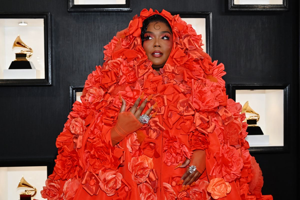 lizzo at grammys in orange flower outfit and orange nails