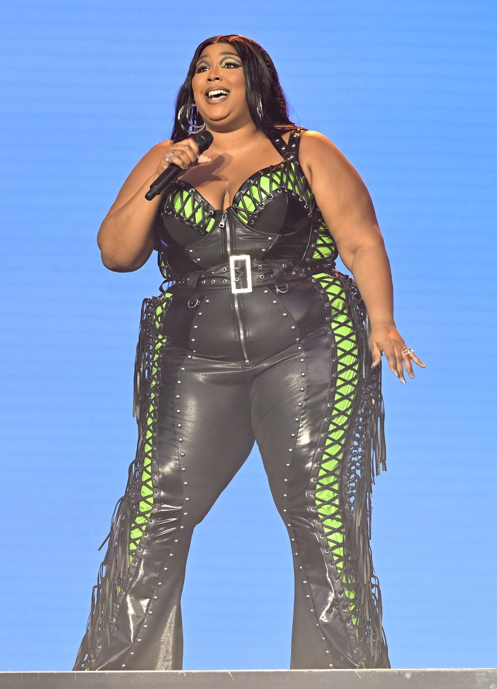 Lizzo rocks a skintight sequined jumpsuit with feathered sleeves while  performing in New York City