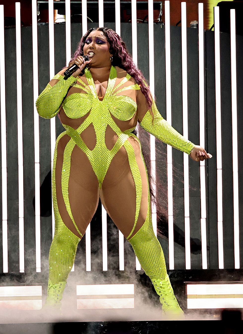 Lizzo Wears Neon and Nude Illusion Catsuit in New York City