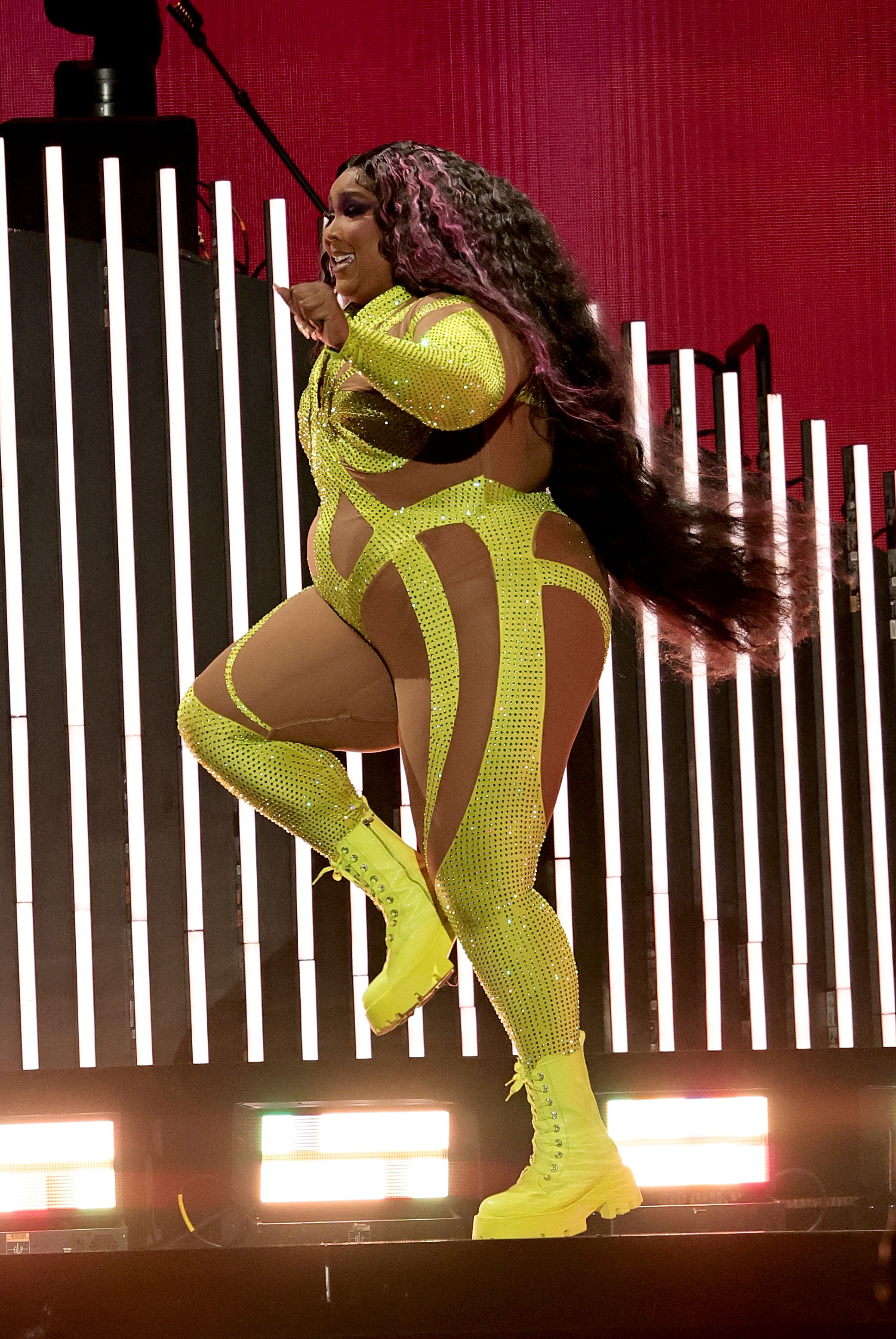 Lizzo Wears Neon and Nude Illusion Catsuit in New York City
