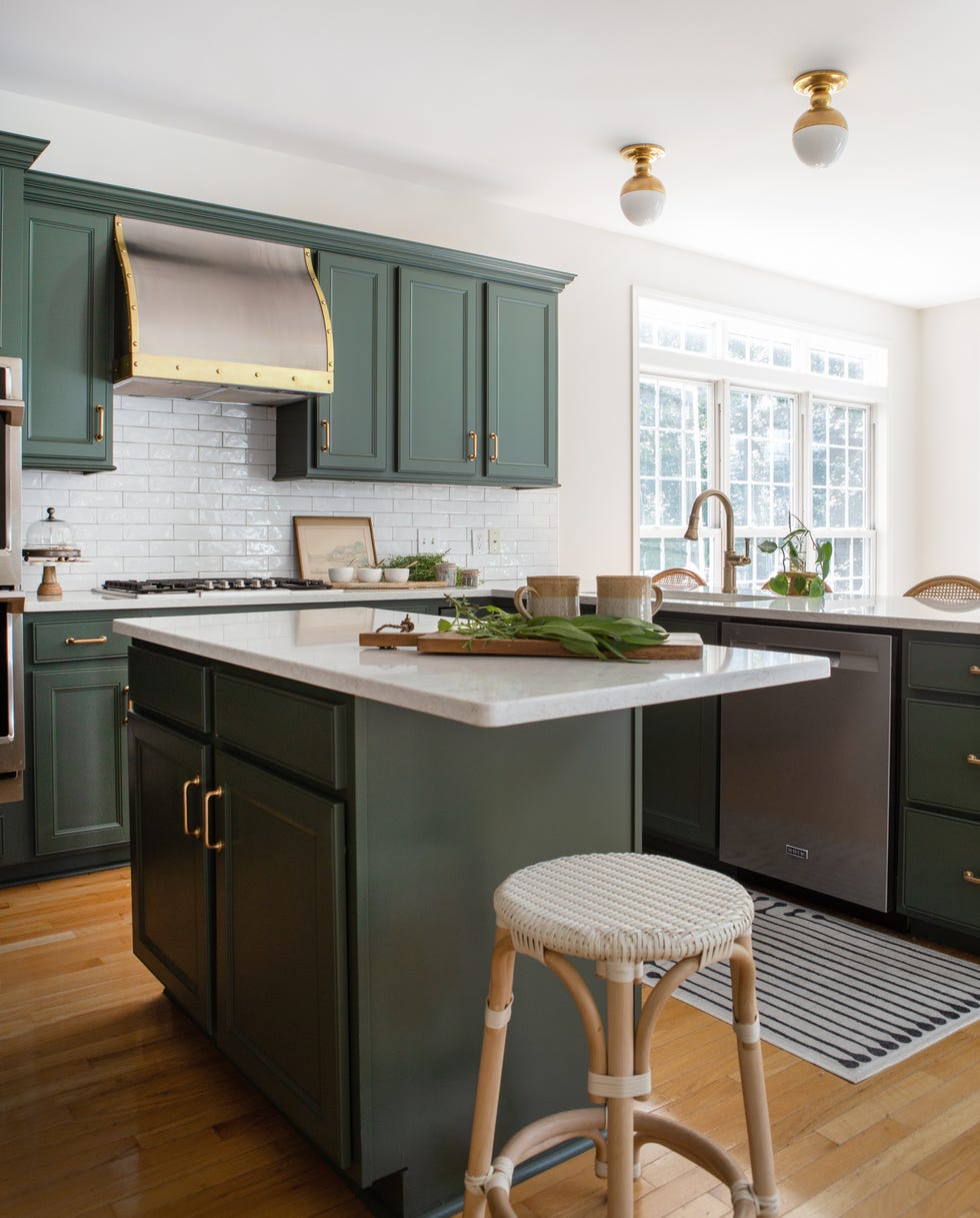 green kitchen island with stool