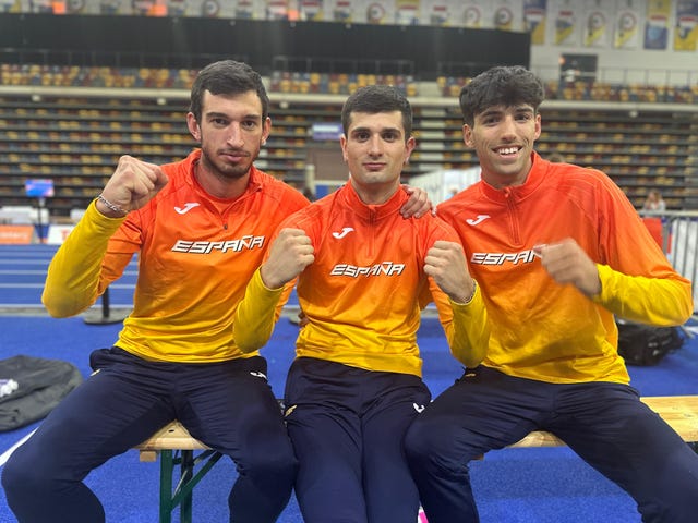 group of three athletes in sportswear showing enthusiasm