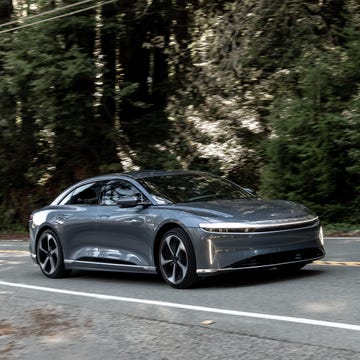 a dark gray 2024 lucid air on a road