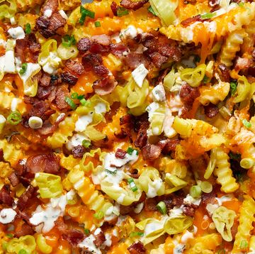loaded nachos with pepperoncini, bacon and cheese