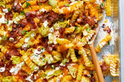 loaded nachos with pepperoncini, bacon and cheese