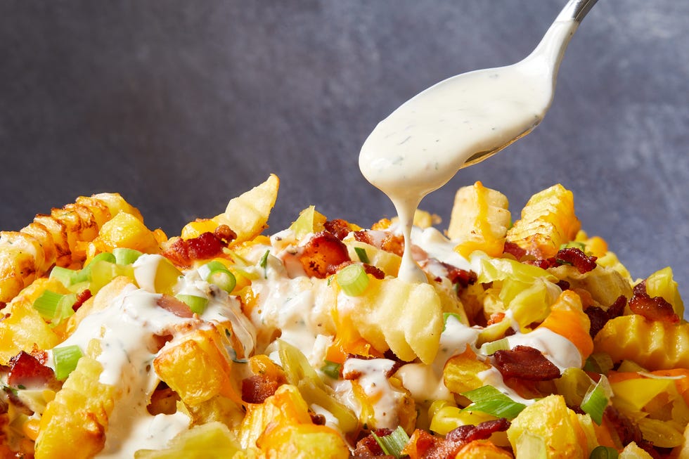 loaded nachos with pepperoncini, bacon and cheese
