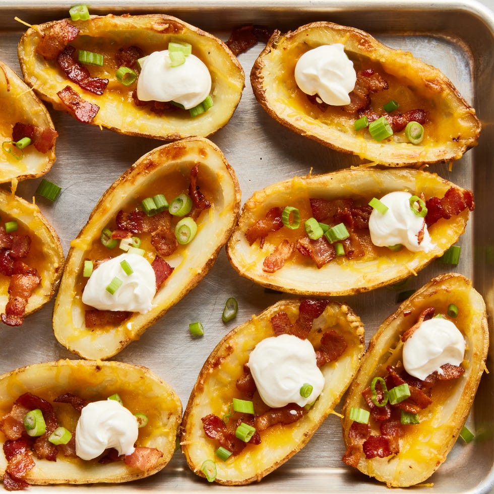 potato skins topped with bacon, chives, and sour cream dollops